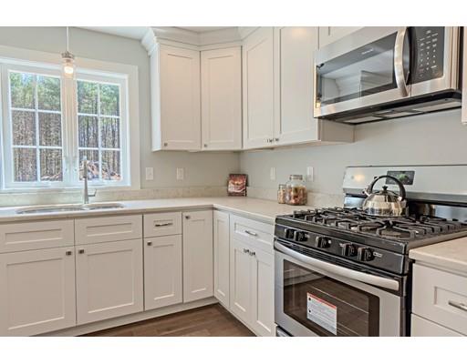 30 Depot Road Ashburnham, MA 01430 - Photo 6 of 30 a kitchen with stainless steel appliances granite countertop white cabinets a stove a sink and dishwasher