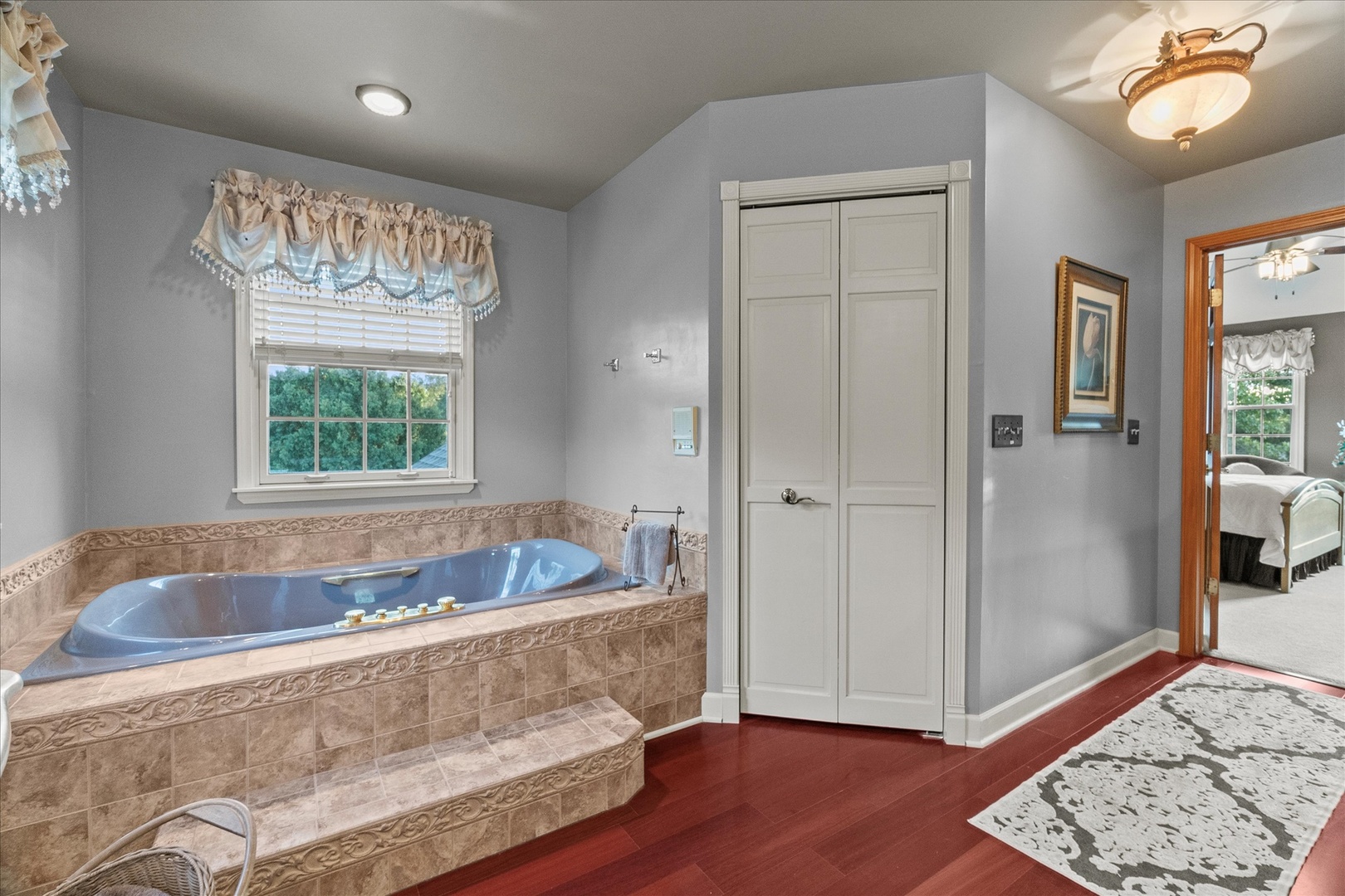 3218 Opengate Road Crystal Lake, IL 60012 - Photo 33 of 60 a bath tub sitting in a bathroom next to a window
