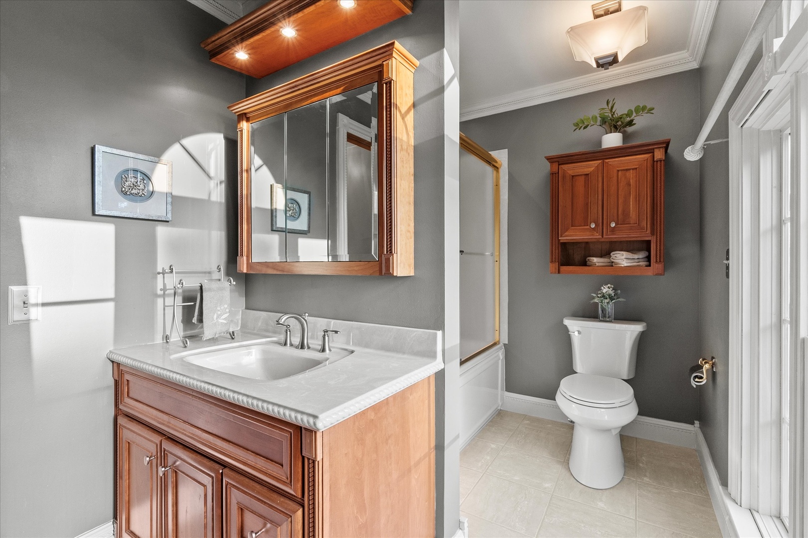 3218 Opengate Road Crystal Lake, IL 60012 - Photo 36 of 60 a bathroom with a toilet sink and mirror
