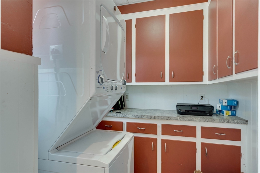 45 Jackson Road Somerville, MA 02145 - Photo 22 of 27 a kitchen with a refrigerator and cabinets