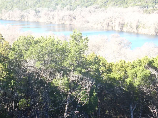 a view of lake with green space