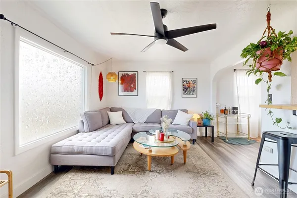 a living room with furniture and a window