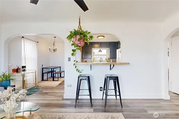 a dining room with furniture and wooden floor