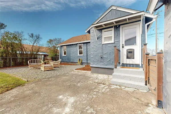a front view of a house with garden