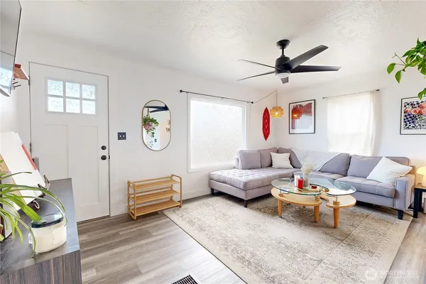 a living room with furniture and a window