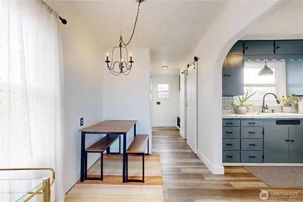 a spacious bathroom with a sink and a mirror