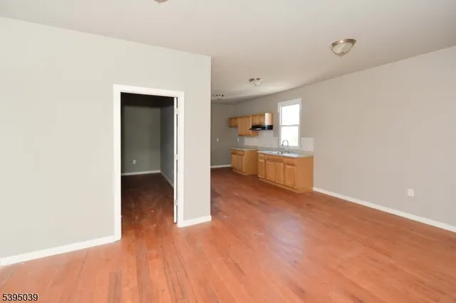 a view of a kitchen cabinets and wooden floor