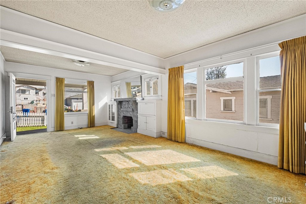 659 West 3rd Street San Pedro, CA 90731 - Photo 11 of 38 a view of an empty room with window and cabinet