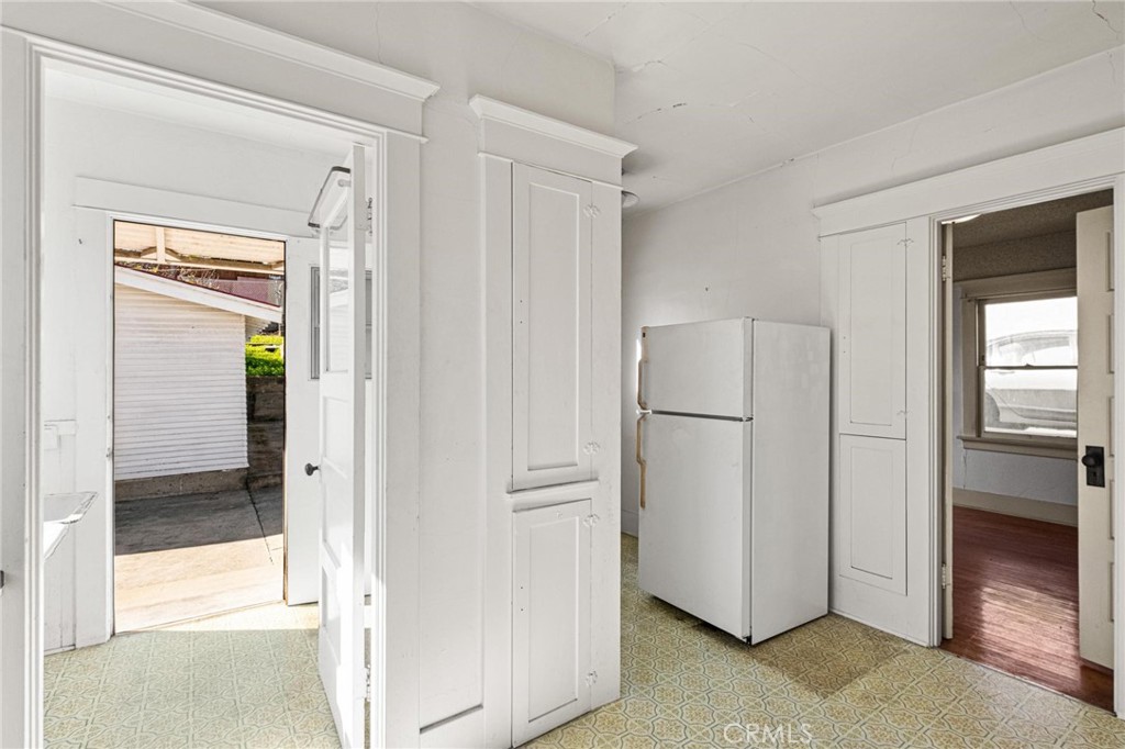 659 West 3rd Street San Pedro, CA 90731 - Photo 15 of 38 a view of cabinets and refrigerator