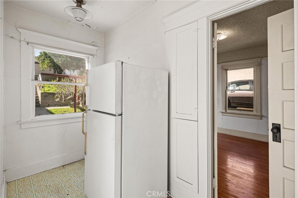 659 West 3rd Street San Pedro, CA 90731 - Photo 16 of 38 a white refrigerator freezer and a window