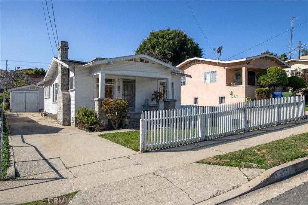 659 West 3rd Street San Pedro, CA 90731 - Photo 38 of 38 a front view of a house with iron fence