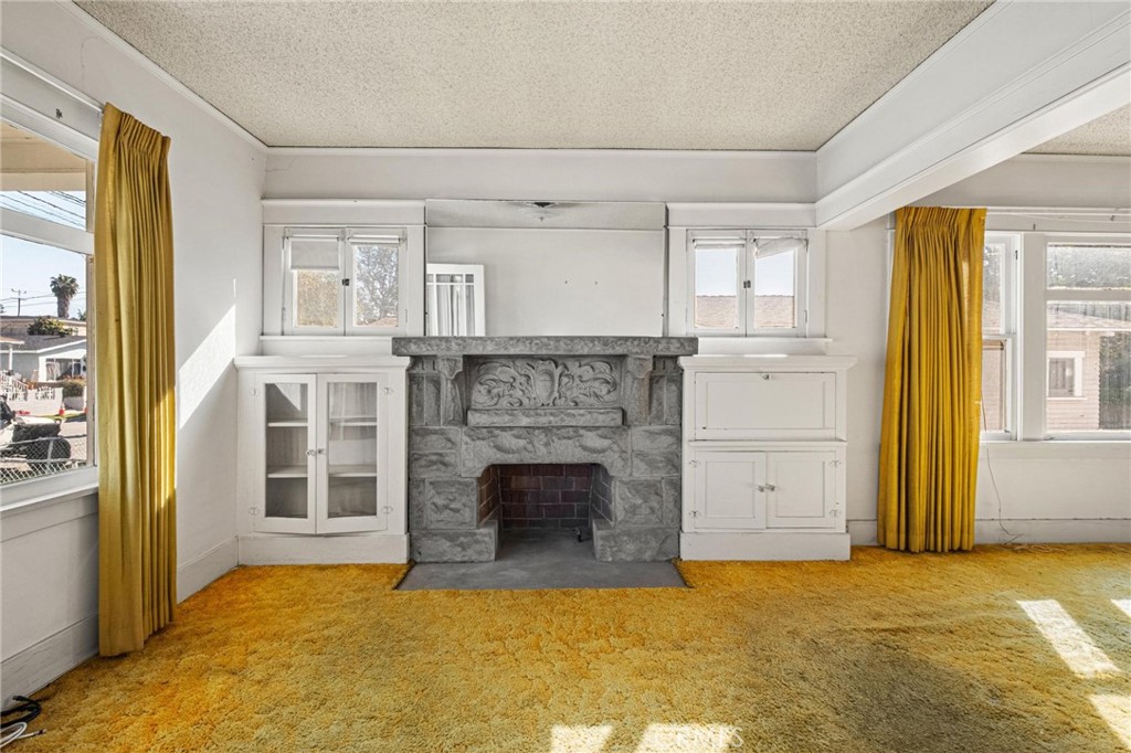 659 West 3rd Street San Pedro, CA 90731 - Photo 5 of 38 a view of a livingroom with a fireplace and window