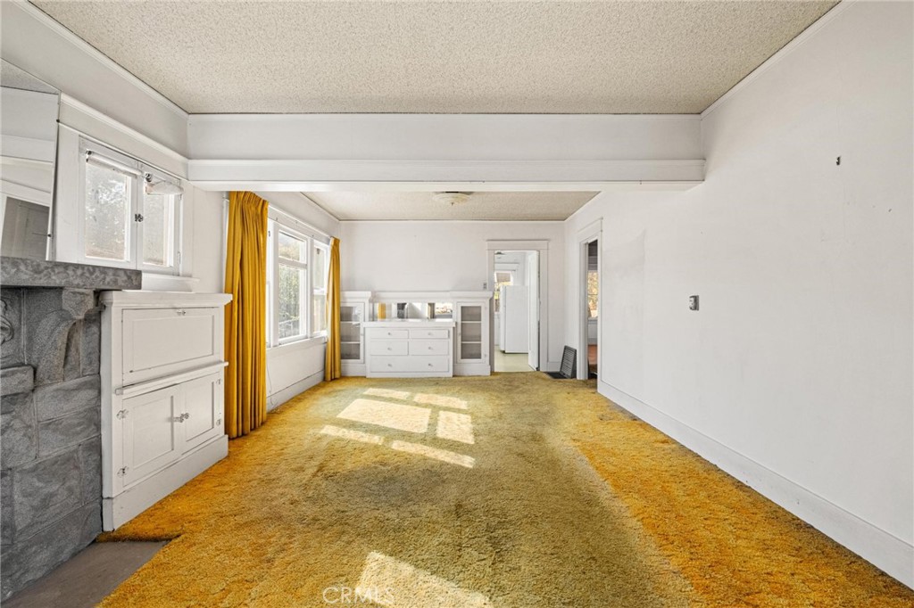 659 West 3rd Street San Pedro, CA 90731 - Photo 9 of 38 a view of a kitchen with refrigerator and cabinet