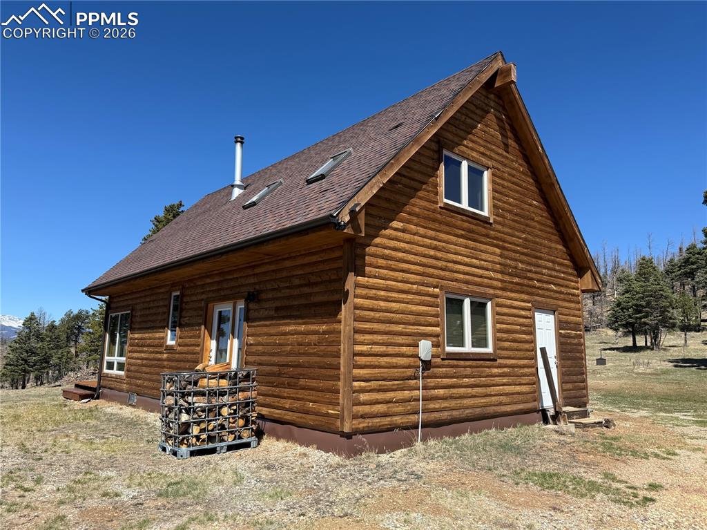 450 Schierl Road Fort Garland, CO 81133 - Photo 17 of 40 a front view of a house with a yard