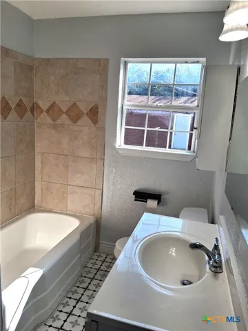 a bathroom with a sink and a bathtub