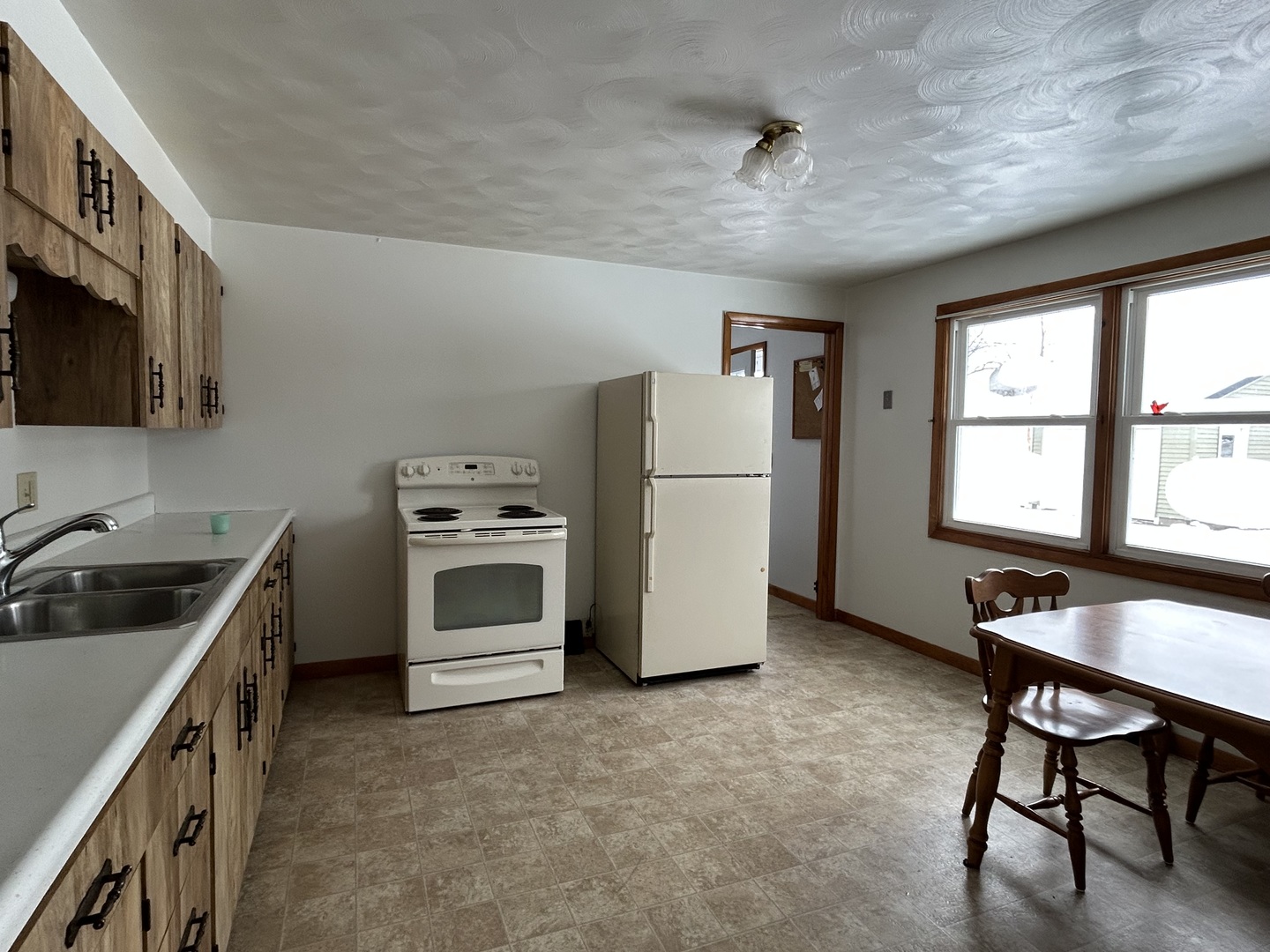 30368 Prairie Road Rock Falls, IL 61071 - Photo 3 of 10 a kitchen with a stove a refrigerator and a sink
