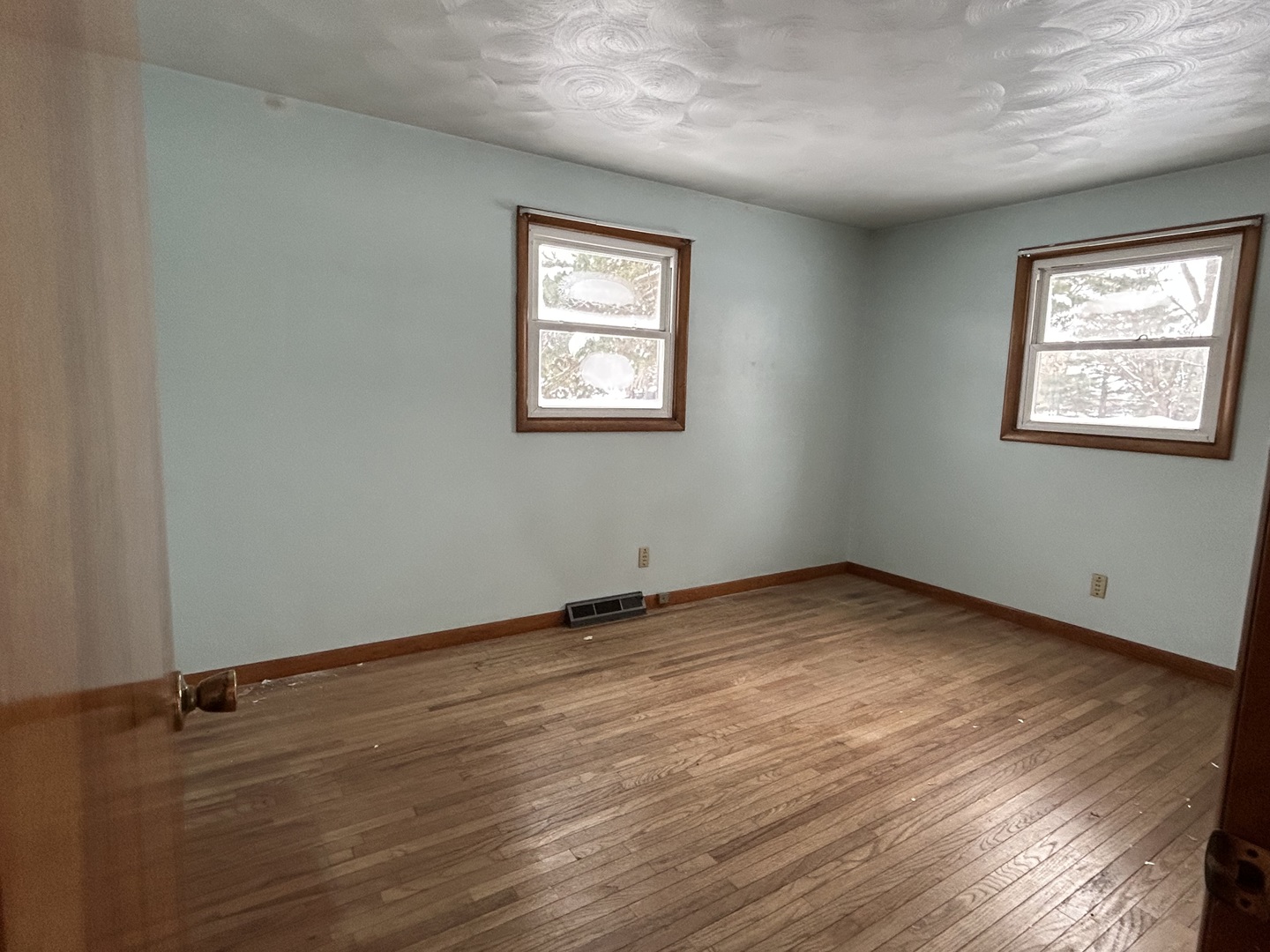 30368 Prairie Road Rock Falls, IL 61071 - Photo 9 of 10 an empty room with wooden floor and windows