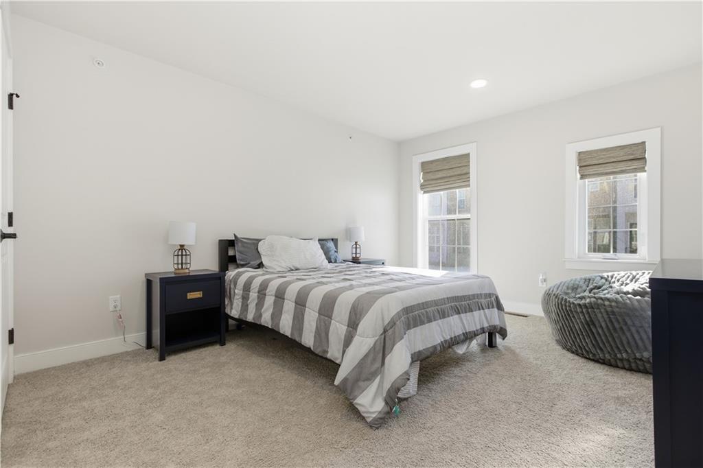 247 Limehouse Road Cranberry Township, PA 16066 - Photo 16 of 43 a bedroom with a bed and a chair