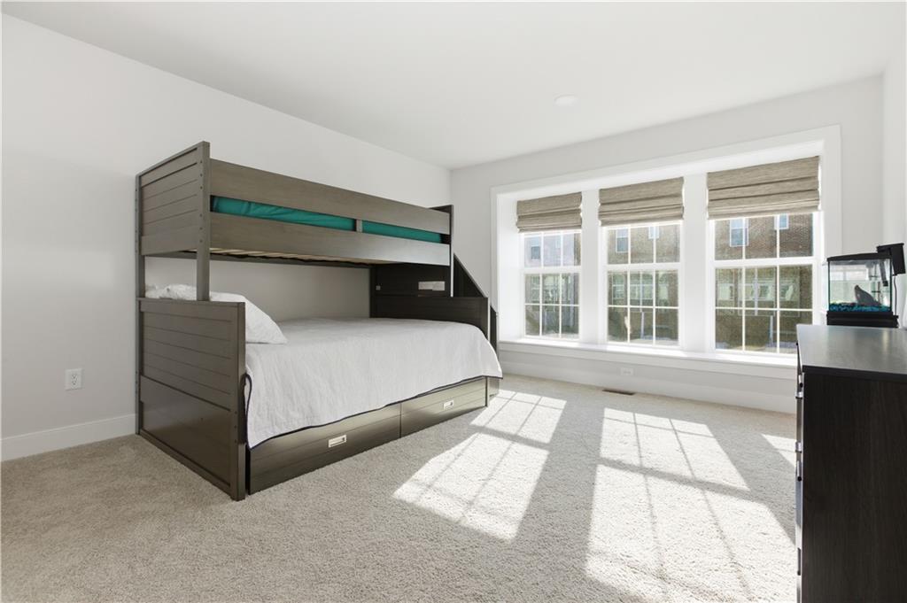 247 Limehouse Road Cranberry Township, PA 16066 - Photo 19 of 43 a bed sitting in a bedroom next to a window