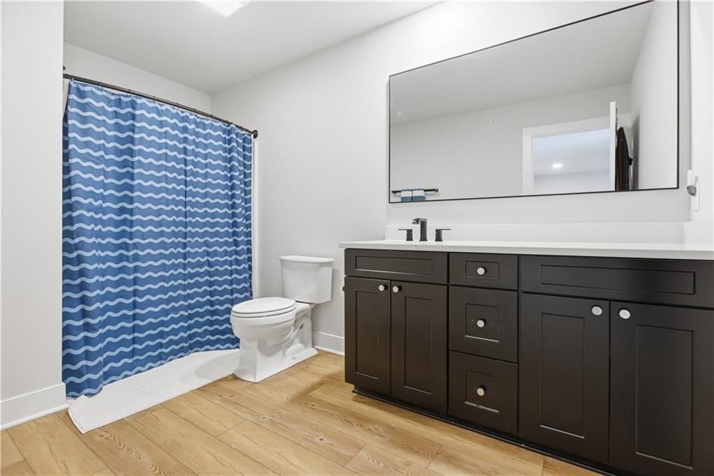 247 Limehouse Road Cranberry Township, PA 16066 - Photo 21 of 43 a bathroom with a toilet a sink and mirror