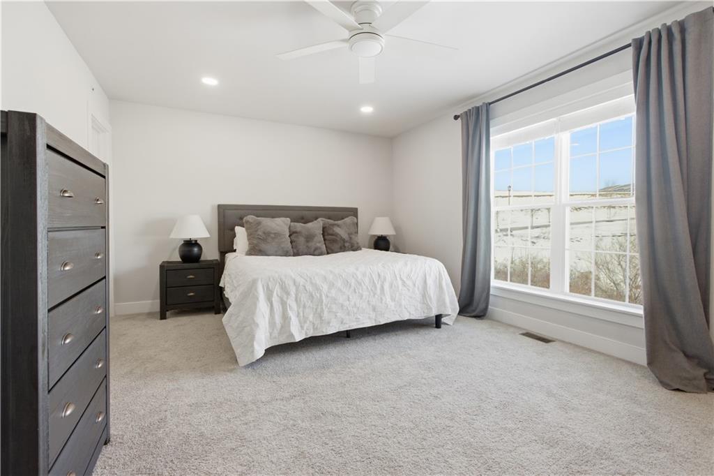247 Limehouse Road Cranberry Township, PA 16066 - Photo 22 of 43 a bedroom with a bed and a large window