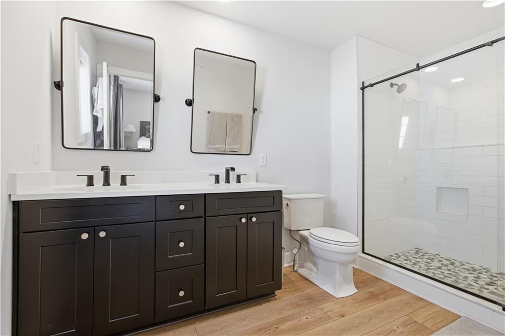 247 Limehouse Road Cranberry Township, PA 16066 - Photo 24 of 43 a bathroom with a double vanity sink toilet and shower