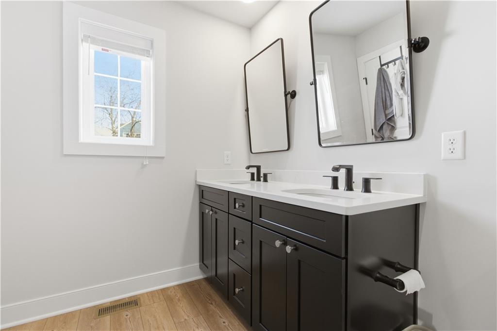 247 Limehouse Road Cranberry Township, PA 16066 - Photo 25 of 43 a bathroom with a sink vanity and mirror