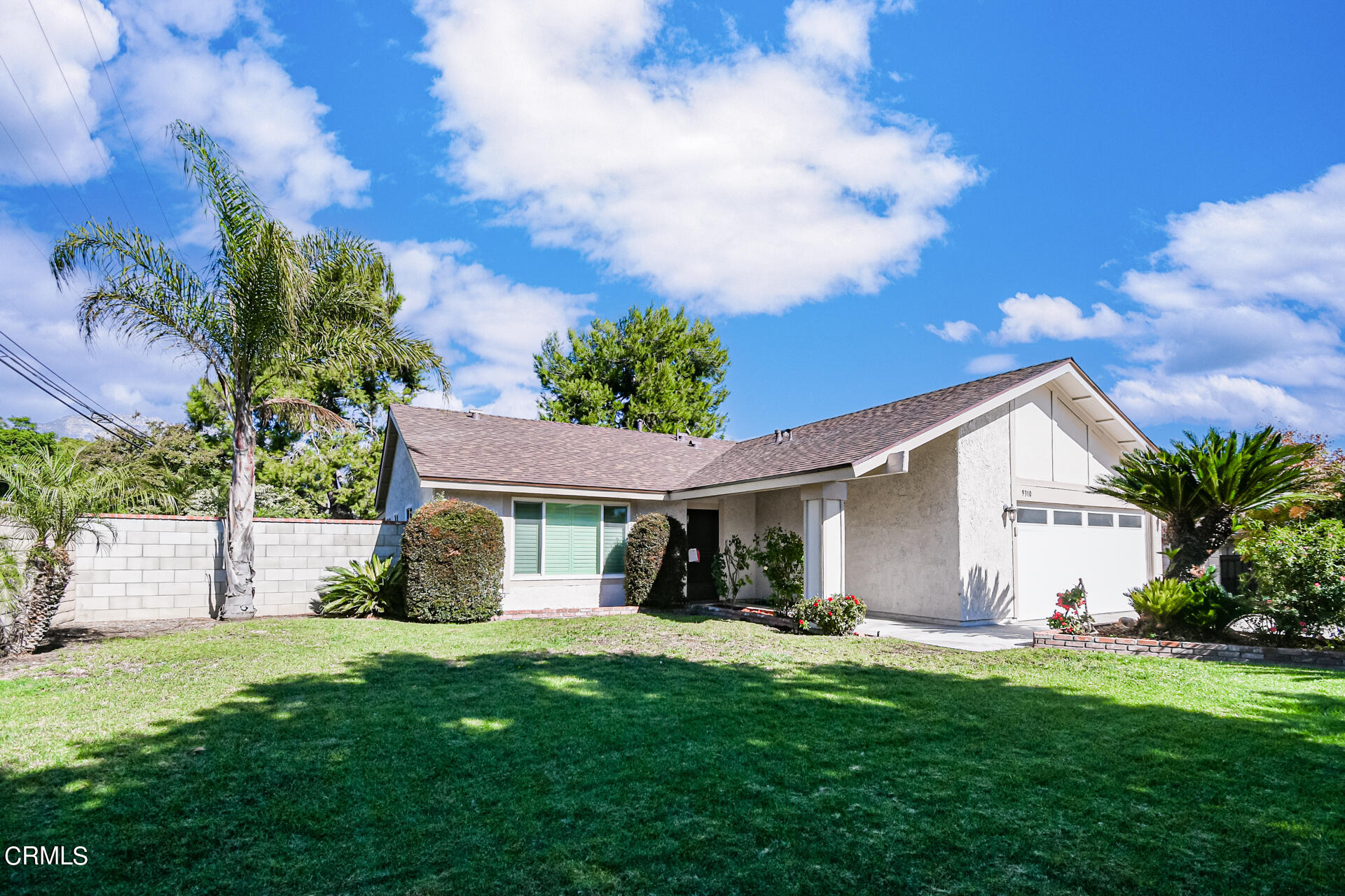 9310 Friant Street Rancho Cucamonga, CA 91730 - Photo 1 of 26 a front view of house with a garden