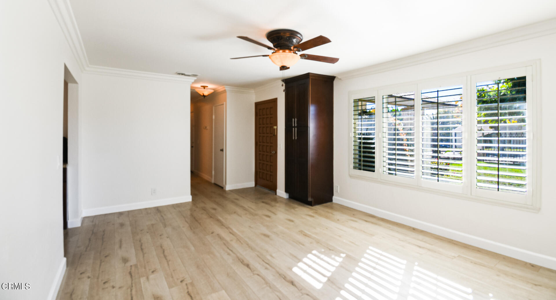 9310 Friant Street Rancho Cucamonga, CA 91730 - Photo 11 of 26 a view of an empty room with wooden floor and a window