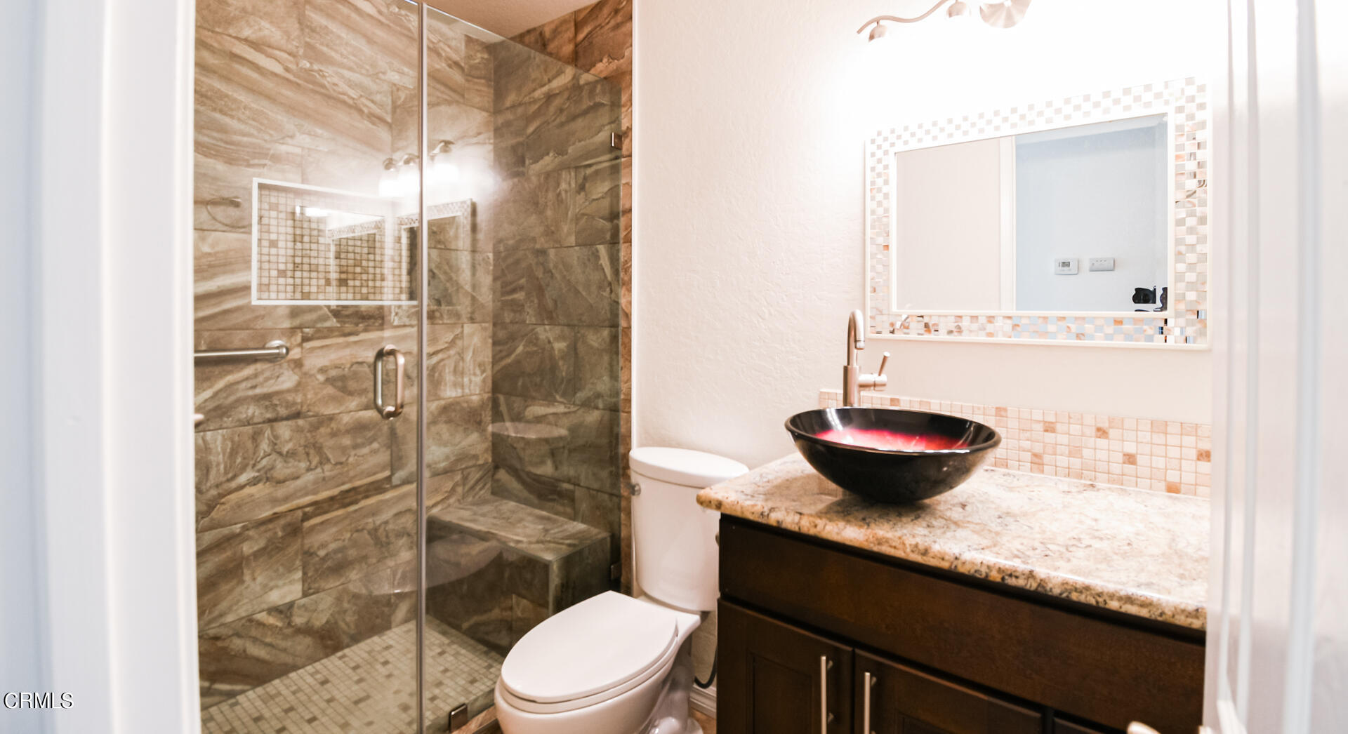 9310 Friant Street Rancho Cucamonga, CA 91730 - Photo 12 of 26 a bathroom with a granite countertop sink a toilet and shower