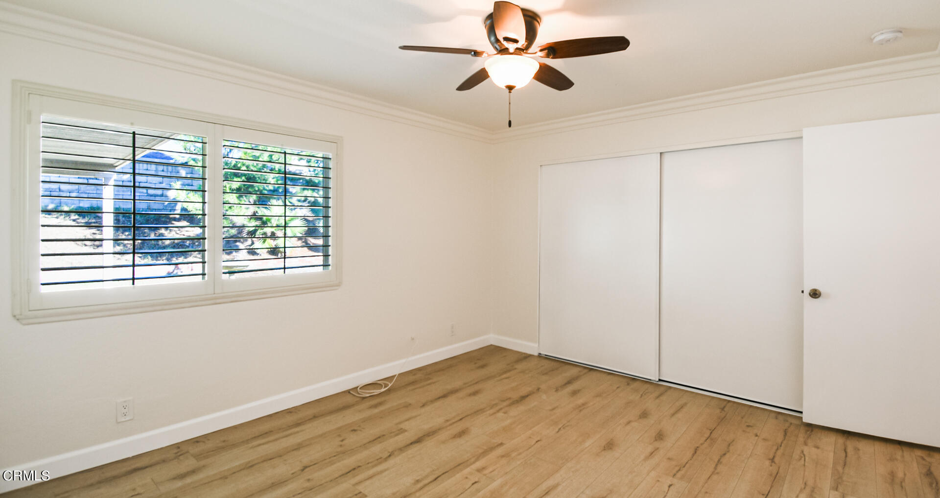 9310 Friant Street Rancho Cucamonga, CA 91730 - Photo 13 of 26 a view of empty room with wooden floor and fan