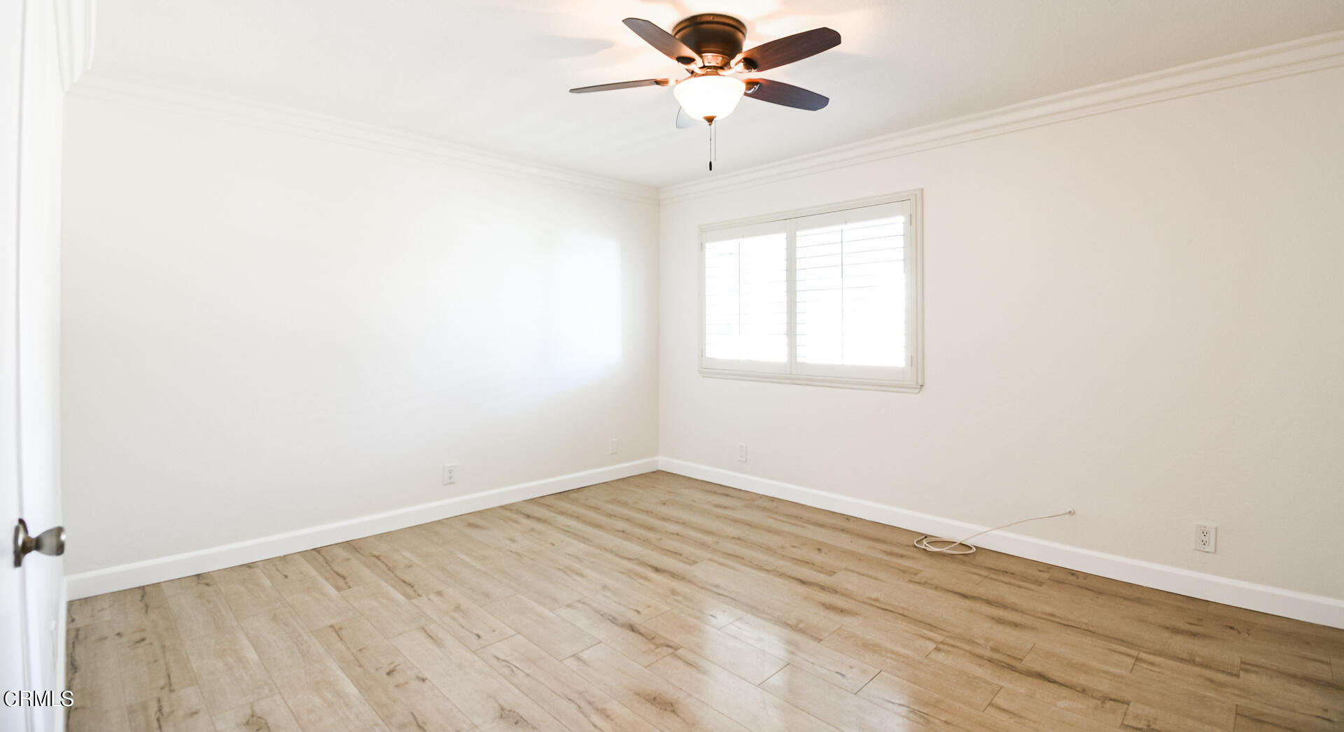 9310 Friant Street Rancho Cucamonga, CA 91730 - Photo 16 of 26 an empty room with a window and a fan