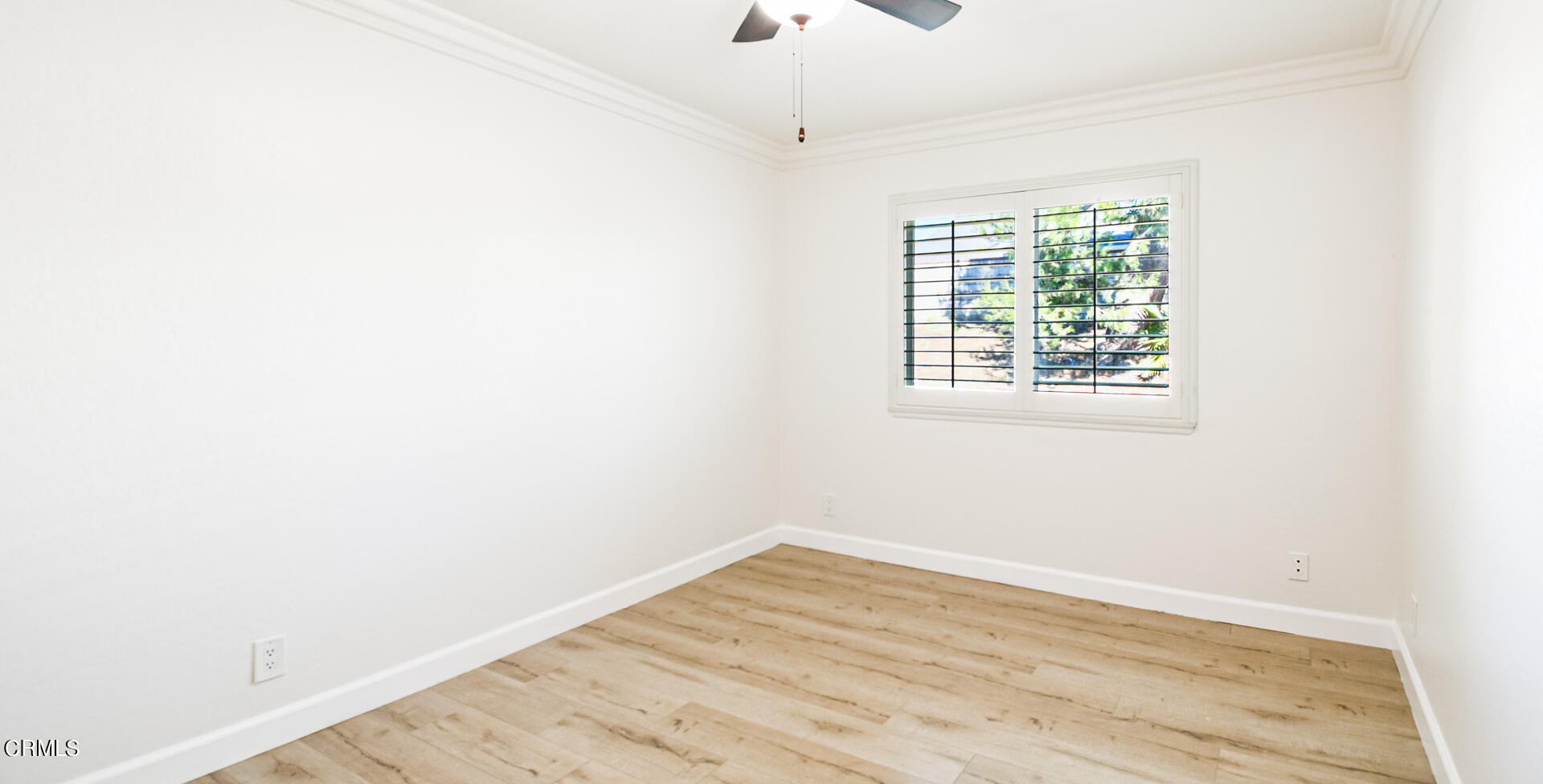 9310 Friant Street Rancho Cucamonga, CA 91730 - Photo 19 of 26 an empty room with wooden floor and windows