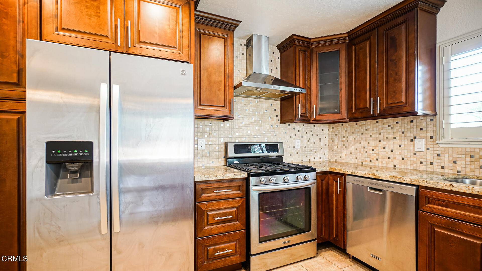 9310 Friant Street Rancho Cucamonga, CA 91730 - Photo 8 of 26 a kitchen with stainless steel appliances granite countertop a refrigerator and a sink