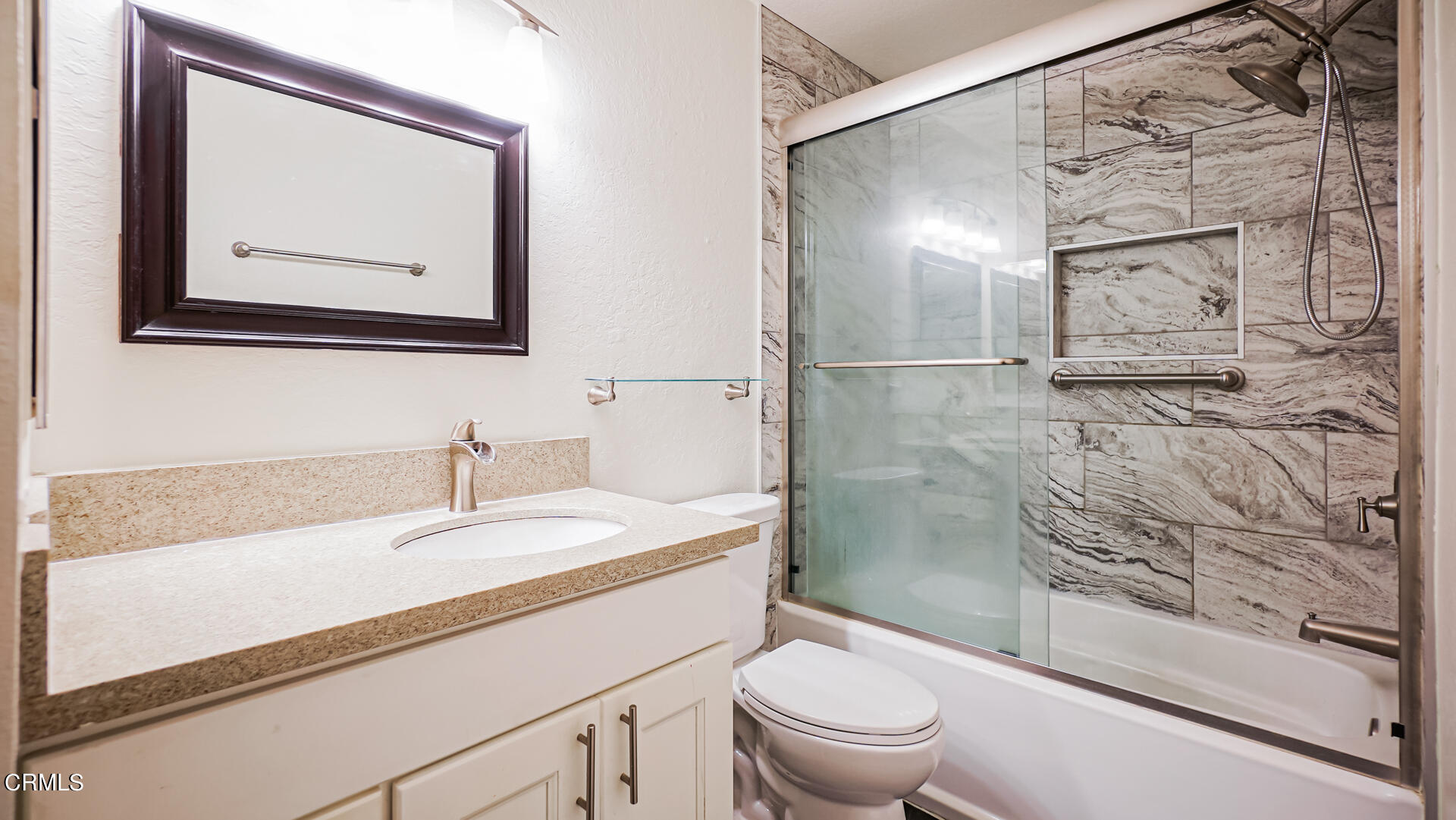 9310 Friant Street Rancho Cucamonga, CA 91730 - Photo 9 of 26 a bathroom with a granite countertop sink toilet and shower