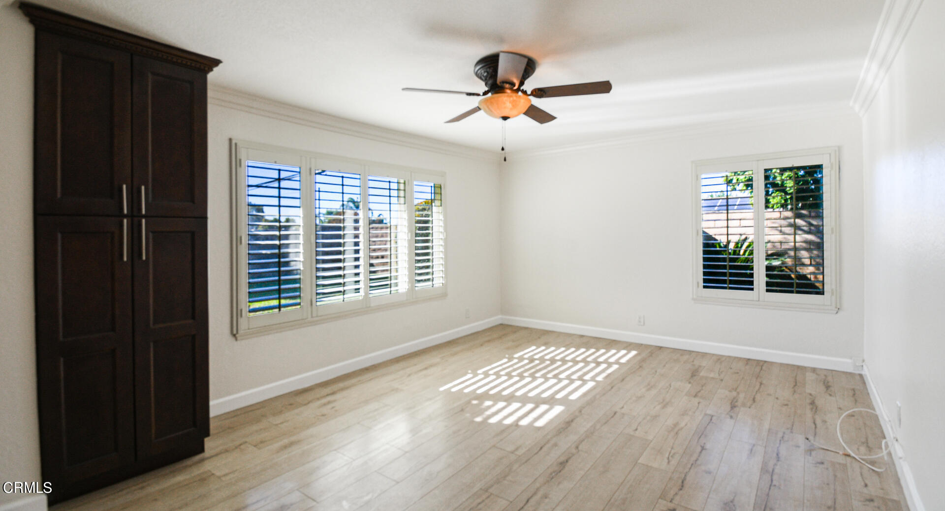 9310 Friant Street Rancho Cucamonga, CA 91730 - Photo 10 of 26 a view of an empty room with wooden floor and a window