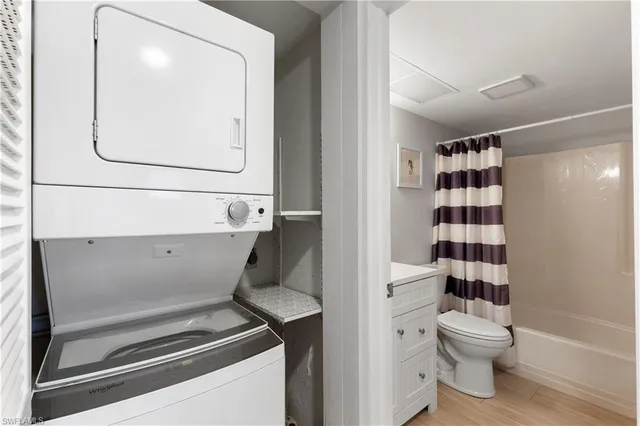 a bathroom with a toilet a sink and a mirror