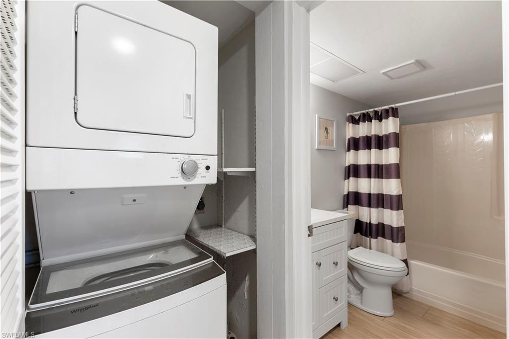 1008 Manatee Road, Unit G103 Naples, FL 34114 - Photo 16 of 24 a bathroom with a toilet a sink and a mirror