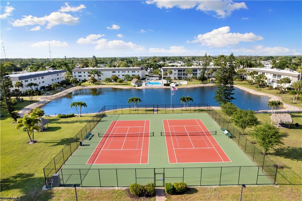 1008 Manatee Road, Unit G103 Naples, FL 34114 - Photo 17 of 24 a view of a tennis court