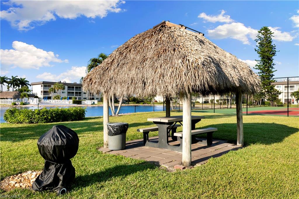 1008 Manatee Road, Unit G103 Naples, FL 34114 - Photo 20 of 24 a view of a garden with sitting area