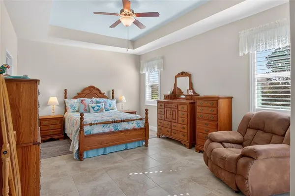 a bedroom with furniture and a window