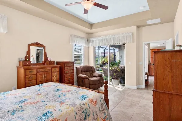 a bedroom with a bed dresser and a window