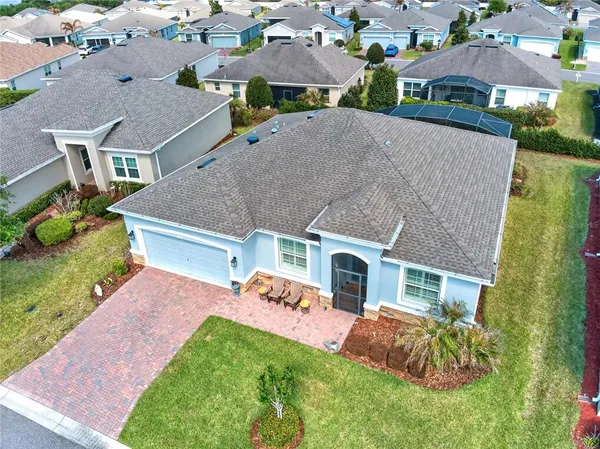 a aerial view of a house with a yard