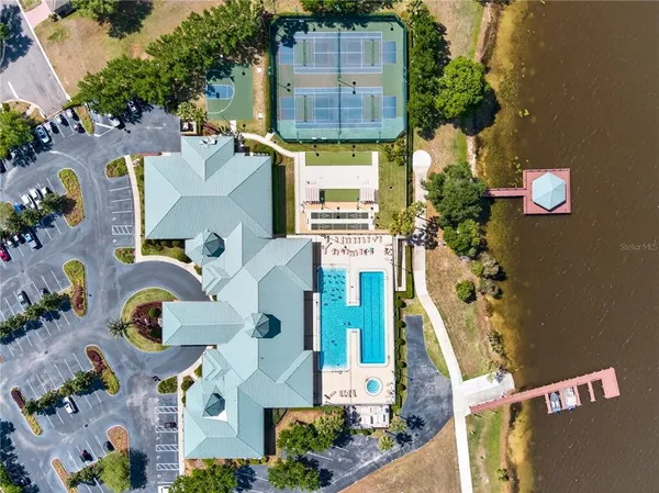 an aerial view of residential house with outdoor space and swimming pool