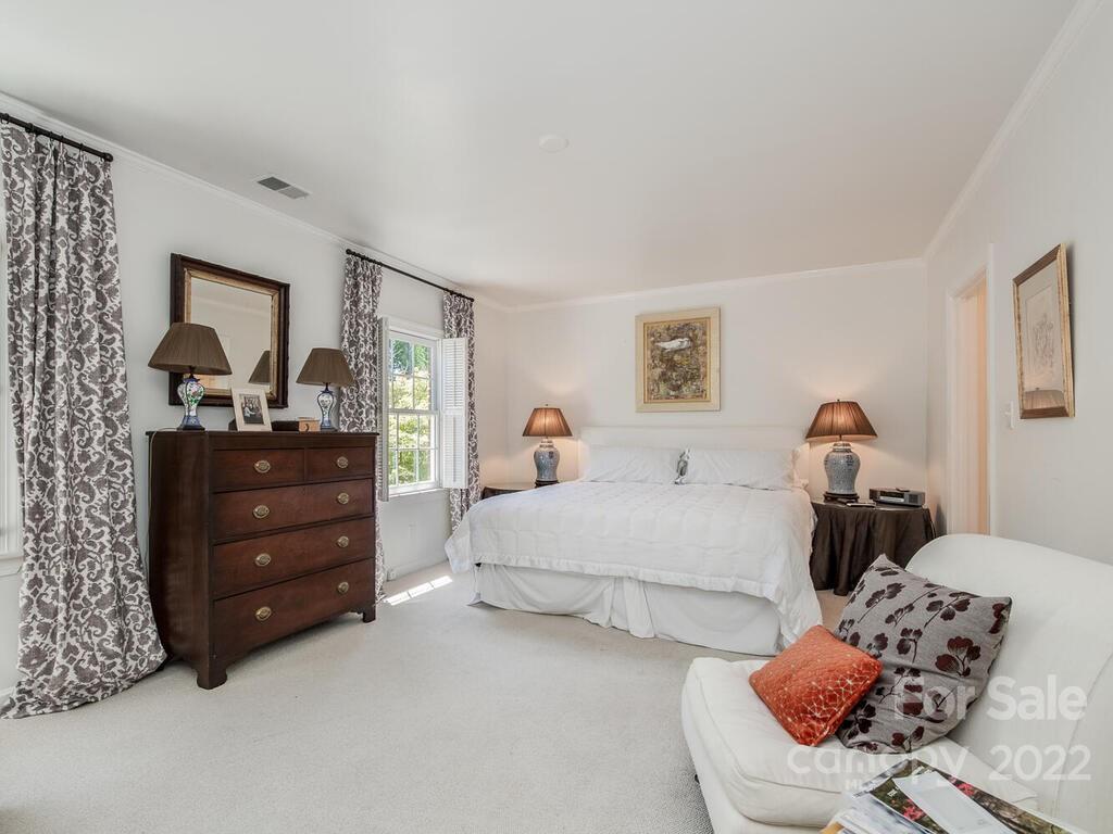 1931 Queens Road Charlotte, NC 28207 - Photo 14 of 23 a bedroom with a bed and a dresser