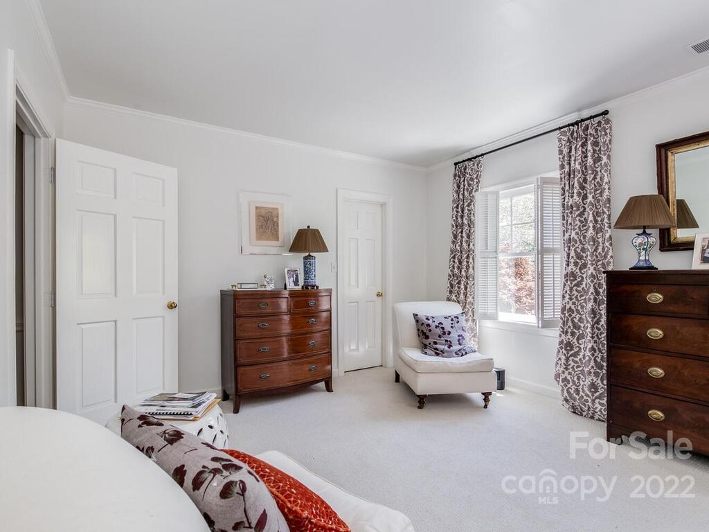 1931 Queens Road Charlotte, NC 28207 - Photo 15 of 23 a bedroom with a bed and a dresser