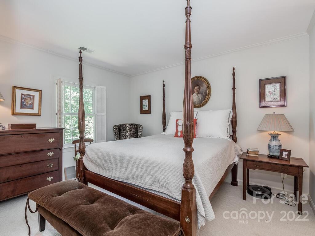 1931 Queens Road Charlotte, NC 28207 - Photo 17 of 23 a bedroom with bed and a window