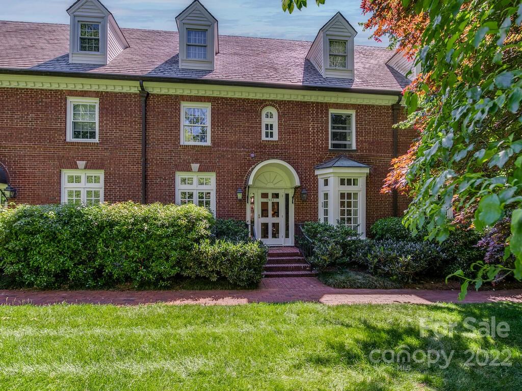 1931 Queens Road Charlotte, NC 28207 - Photo 2 of 23 a front view of a house with a garden