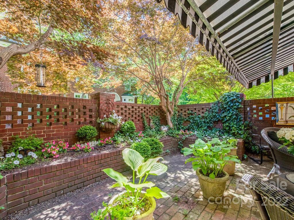 1931 Queens Road Charlotte, NC 28207 - Photo 22 of 23 a view of a garden with patio