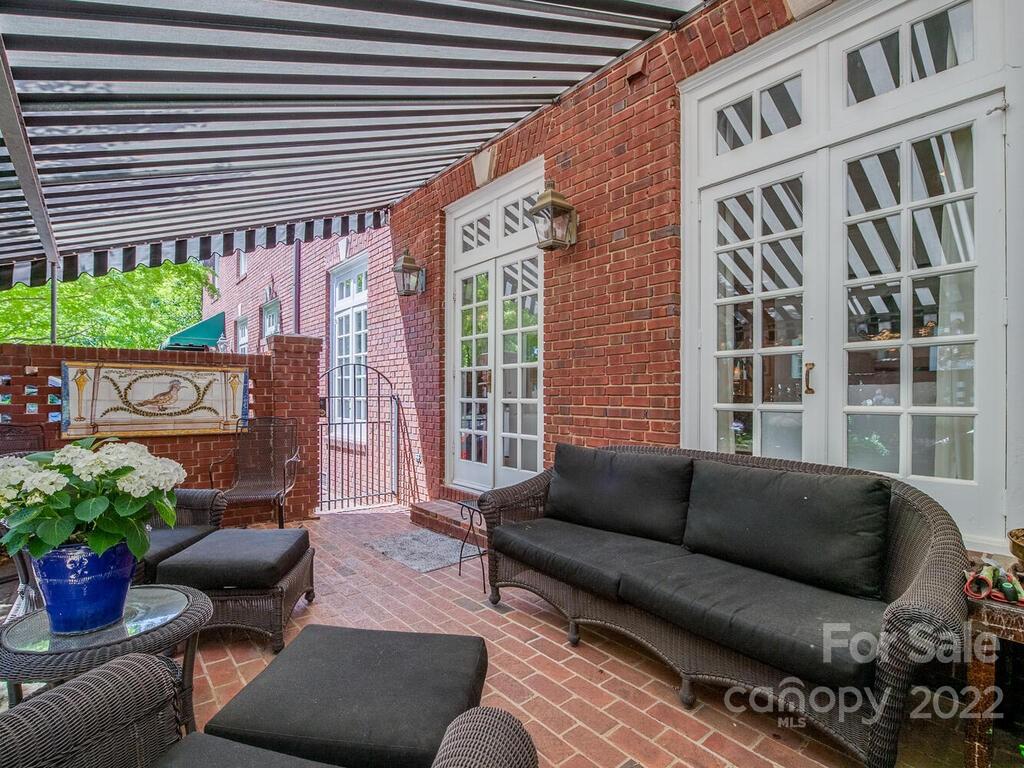 1931 Queens Road Charlotte, NC 28207 - Photo 23 of 23 a view of a patio with couches and potted plants